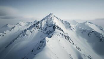 Snow-Capped Mountains Under a Misty Sky at Dawn photo