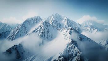 Snow-Capped Mountain Peaks Amidst Misty Clouds in Majestic Alpine Landscape photo