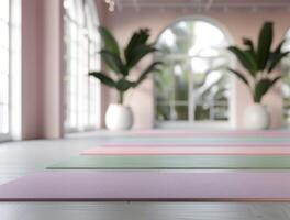 Yoga Mats Set Up for Morning Class in Tranquil Studio With Large Windows photo