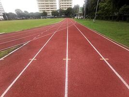 The running track inside a football stadium is usually a circular pathway surrounding the field photo