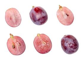Top view set of two red grapes or purple grapes with halves isolated on white background with clipping path photo