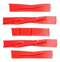 Top view set of wrinkled red adhesive vinyl tape or cloth tape in stripe shape isolated on white background with clipping path photo