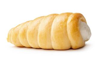 Side view of brown puff pastry cream horn isolated on white background with clipping path photo