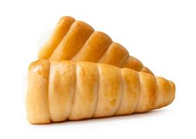 Side view of puff pastry cream horns in stack isolated on white background with clipping path photo