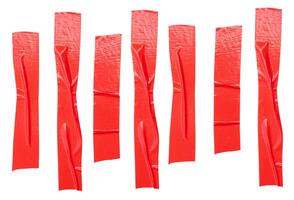 Top view set of wrinkled red adhesive vinyl tape or cloth tape in stripe shape isolated on white background with clipping path photo