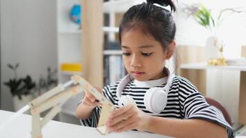 STEM education concept. Asian students learn at home with STEM toys, mathematics engineering science technology computer code in robotics for kids' concepts. photo