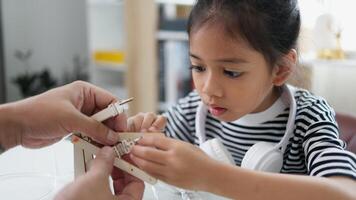 STEM education concept. Asian students learn at home with STEM toys, mathematics engineering science technology computer code in robotics for kids' concepts. photo