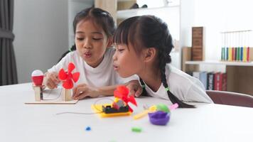 STEM education concept. Asian students learn at home with STEM toys, mathematics engineering science technology computer code in robotics for kids' concepts. photo