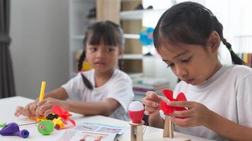 STEM education concept. Asian students learn at home with STEM toys, mathematics engineering science technology computer code in robotics for kids' concepts. photo