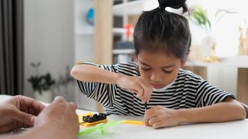 STEM education concept. Asian students learn at home with STEM toys, mathematics engineering science technology computer code in robotics for kids' concepts. photo