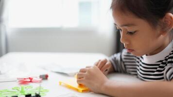 STEM education concept. Asian students learn at home with STEM toys, mathematics engineering science technology computer code in robotics for kids' concepts. photo