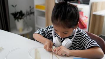 STEM education concept. Asian students learn at home with STEM toys, mathematics engineering science technology computer code in robotics for kids' concepts. photo