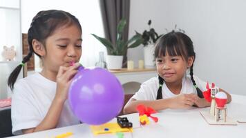 STEM education concept. Asian students learn at home with STEM toys, mathematics engineering science technology computer code in robotics for kids' concepts. photo