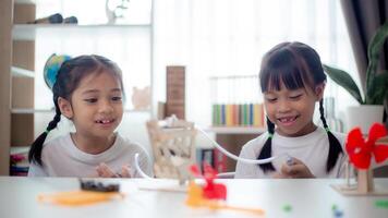 STEM education concept. Asian students learn at home with STEM toys, mathematics engineering science technology computer code in robotics for kids' concepts. photo