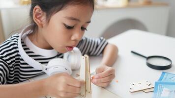 STEM education concept. Asian students learn at home with STEM toys, mathematics engineering science technology computer code in robotics for kids' concepts. photo