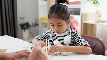 STEM education concept. Asian students learn at home with STEM toys, mathematics engineering science technology computer code in robotics for kids' concepts. photo