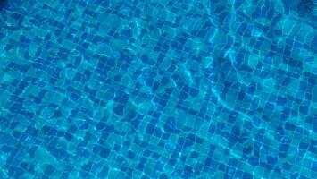 Swimming Pool Surface With Light Reflection and Water Ripple Patterns photo