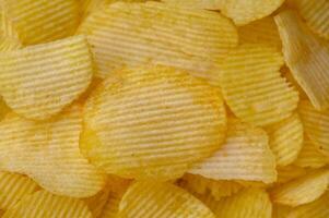 Potato chips snack as background image texture background. Copy, empty space for text photo
