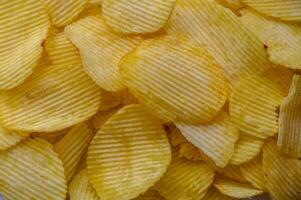 Crispy potato chips snack texture background. Top view. Flat lay 1 photo