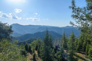view of Troodos Mountains from Mount Olympos in Cyprus photo