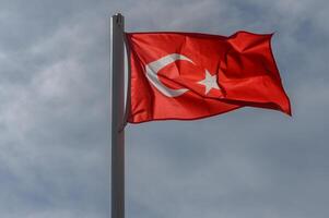 Turkish flag against the sky on a sunny winter day 8 photo