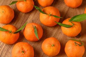 fresh juicy tangerines on a wooden table 16 photo