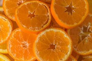 Slices of orange or tangerine . Flat lay, top view. Fruit compositio photo