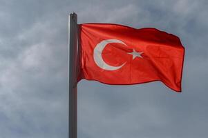 Turkish flag against the sky on a sunny winter day 13 photo