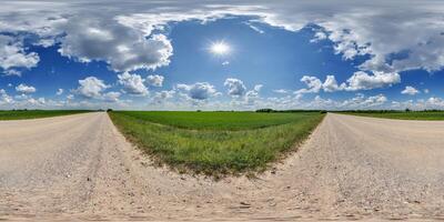 hdri 360 panorama of blue sky with awesome clouds on gravel road among fields in equirectangular full seamless spherical projection, for VR AR content or skydome replacement photo