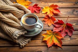 Cup of coffee and autumn leaves photo