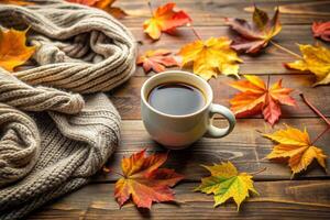 Cup of coffee and autumn leaves photo