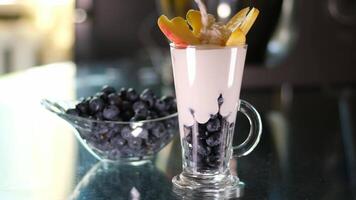 Blueberries with cream yogurt with the addition of ripe blueberries, delicious and fresh natural yogurt with the taste and berries of blueberries video