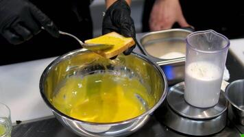 tasty benedict egg breakfast. Eggs Benedict with Hollandaise sauce. Blending hollandaise sauce with a metal spoon, inside a casseroll video