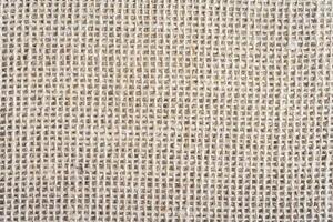 Abstract background, close up photo from a piece of Burlap fabric.