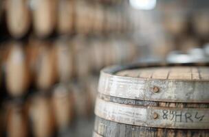 Wooden Barrels In a Rustic Distillery Setting photo