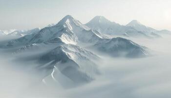 Snow-Capped Mountain Peaks Amidst Misty Clouds in Majestic Alpine Landscape photo