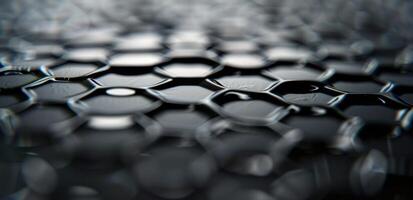 Close-Up View of Hexagonal Pattern With Water Drops on Dark Surface photo