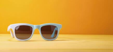Fun Pineapples With Sunglasses and Lemon on Bright Yellow Background photo