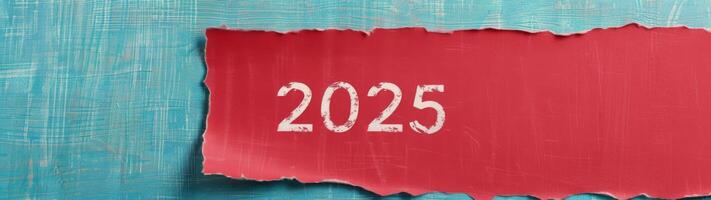 Torn Paper Reveal of 2025 on Textured Blue Background photo