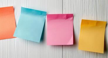 Colorful Sticky Notes Secured With Metal Clips on White Background photo
