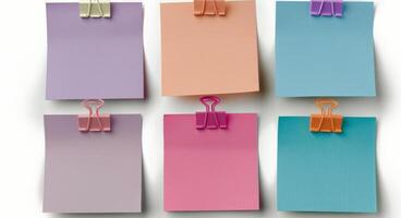 Colorful Sticky Notes Secured With Metal Clips on White Background photo
