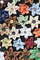 Background many buttons on the fabric in the form of a flower. photo