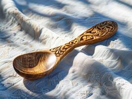 Hand-carved wooden spoon with intricate design. photo