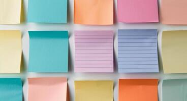 Colorful Sticky Notes Arranged in a Grid Pattern on a White Surface photo