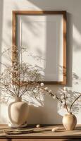 Minimalist mockup with wooden frame, vase and dried flowers. photo