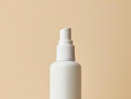 White plastic spray bottle with a fine mist nozzle on a beige background. photo