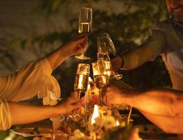a group of people toasting with champagne glasses photo
