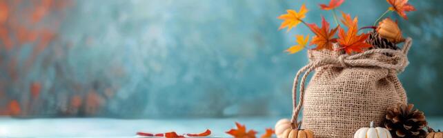 Fall Decor With Burlap Sack And Autumn Leaves photo