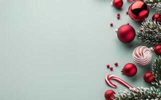 Red Ornaments and Candy Cane on Green Background photo