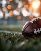 Football on Grass Field With Blurry Lights photo